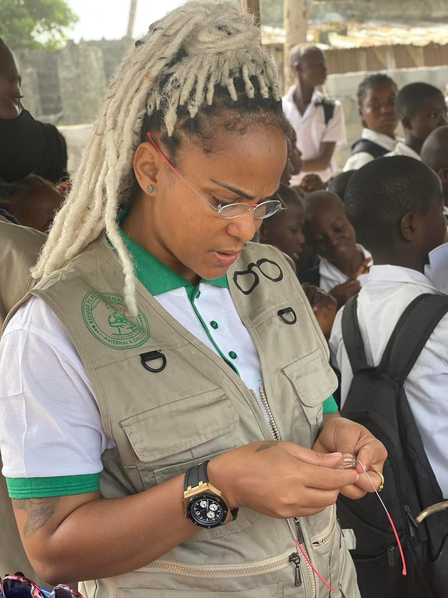 Hon. Karishma Pelham-Raad preparing eyeglasses during the student eye-health outreach
