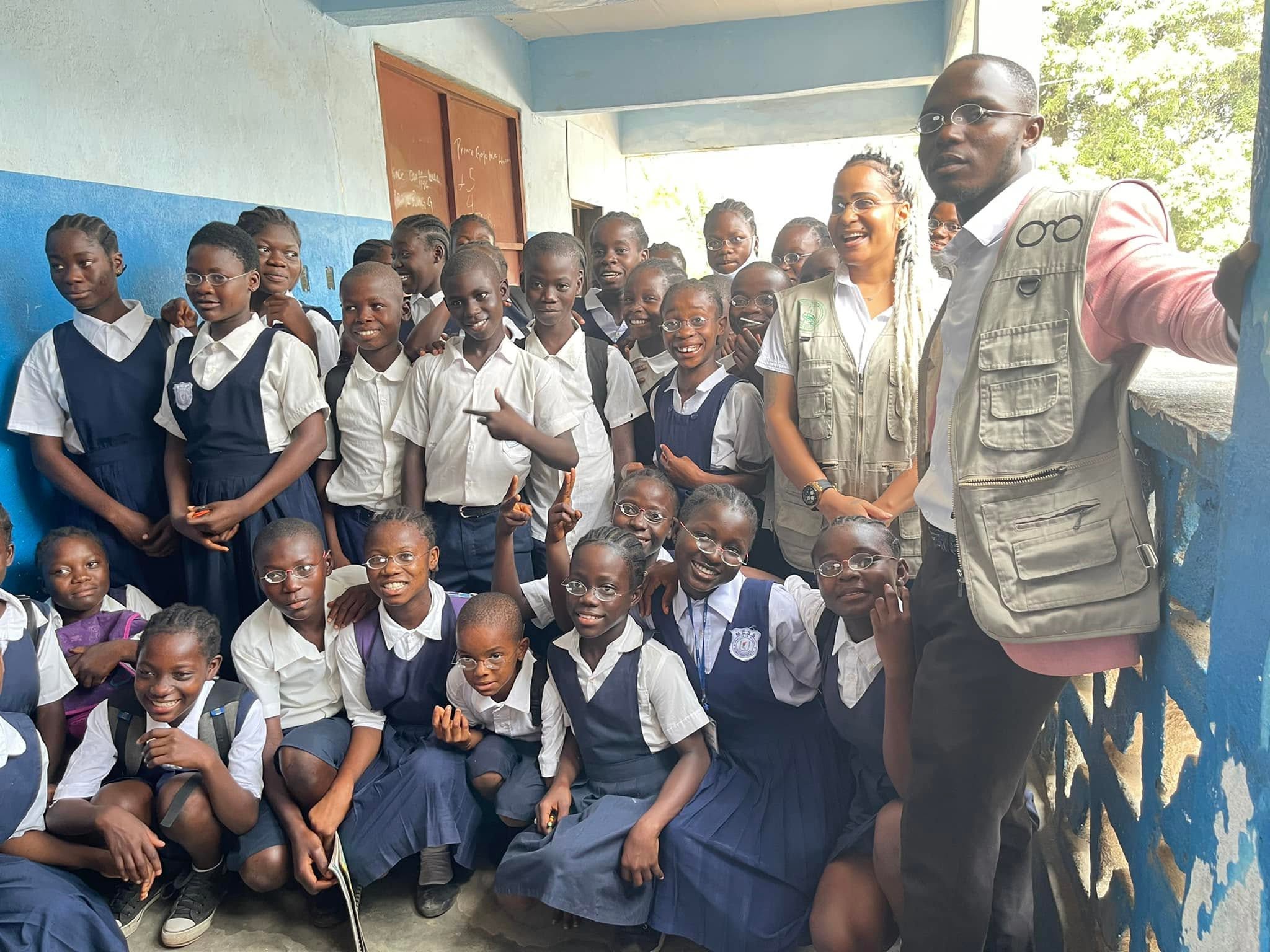 Students wearing eyeglasses with the HRH Charity Foundation outreach team