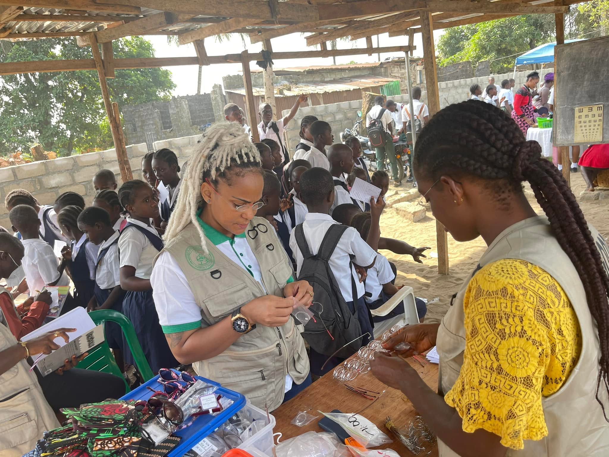 HRH Charity Foundation team distributing eyeglasses to students during the 2022 school eye-health outreach